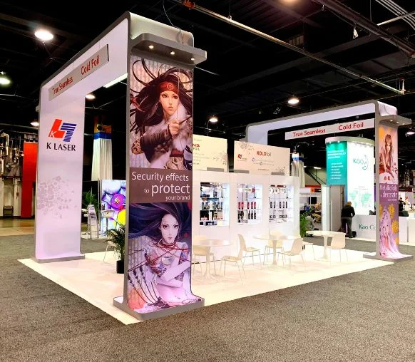 K-Laser medical device trade show display with illuminated backlit graphics and counters