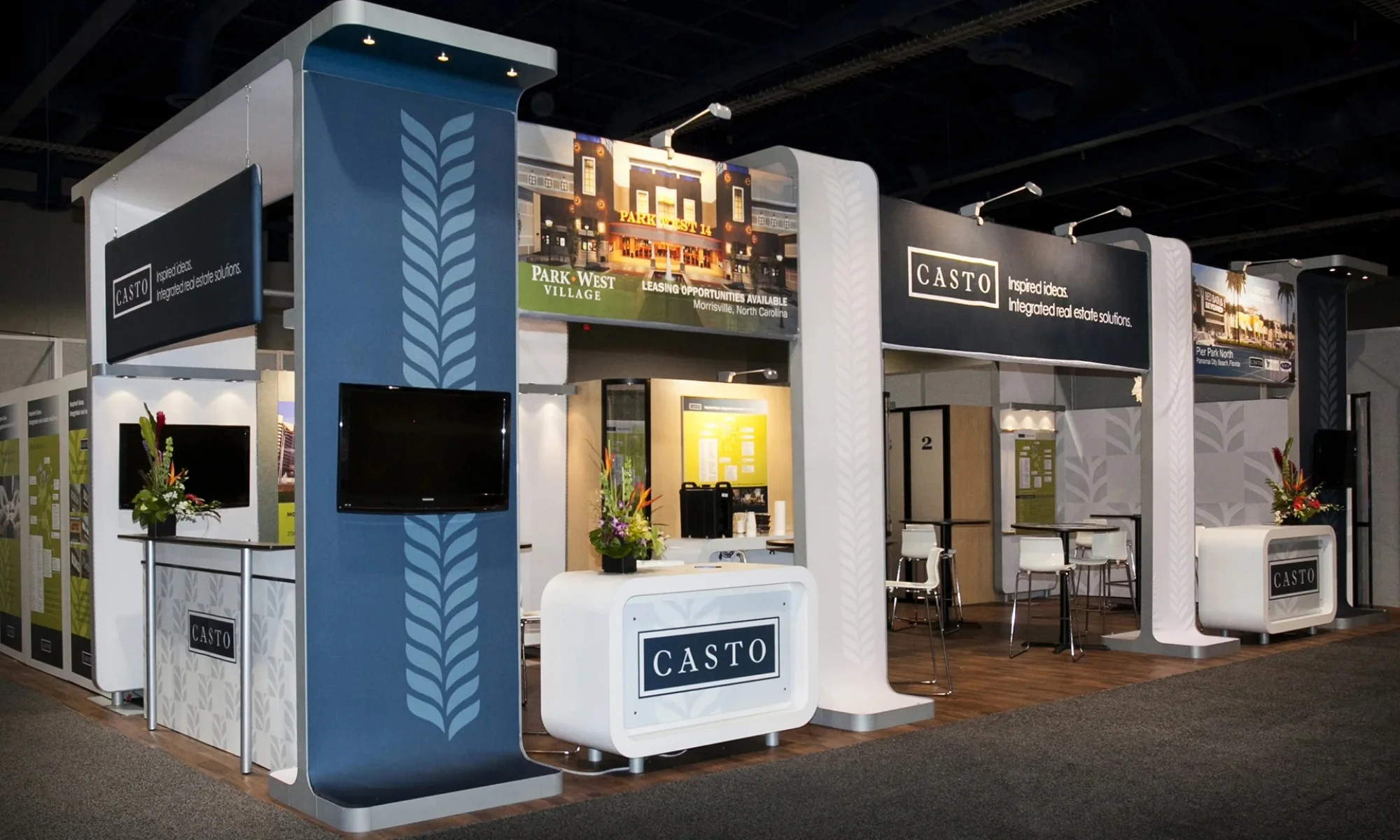 CASTO trade show exhibit with branded real estate graphics, monitors, and reception counters by Suncoast Displays