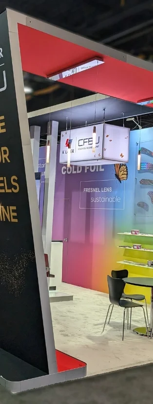 K Laser trade show exhibit with angled framing, illuminated graphics, and gradient color backdrop by Suncoast Displays